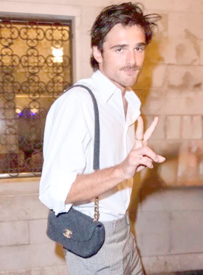 JACOB Elordi carrying a Chanel bag.