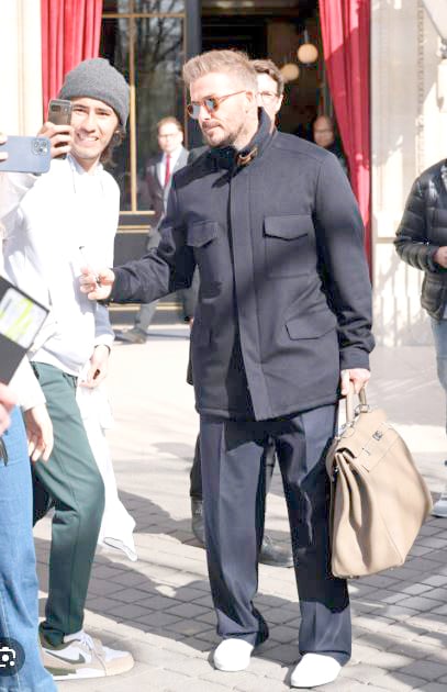 DAVID Beckham was spotted carrying a Kelly Voyage 50 during Paris Fashion Week.
