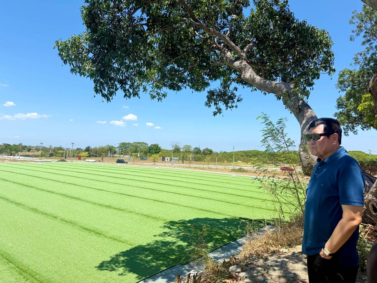 OCULAR visit. Real estate mogul Manny Villar looks at the wide space to be developed as the football stadium for The Stadium in Villar City.