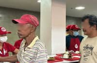 JEEPNEY drivers are treated with a free meal at the Department of Social Welfare and Development Kitchen inside the Nasdake Building in Pasay City on Friday.