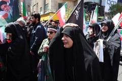 Slain Khamenei supporters hold tribute rally