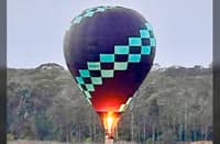 THE hot air balloon slowly descends over Hunter Valley’s vineyards after a scenic sunrise flight.