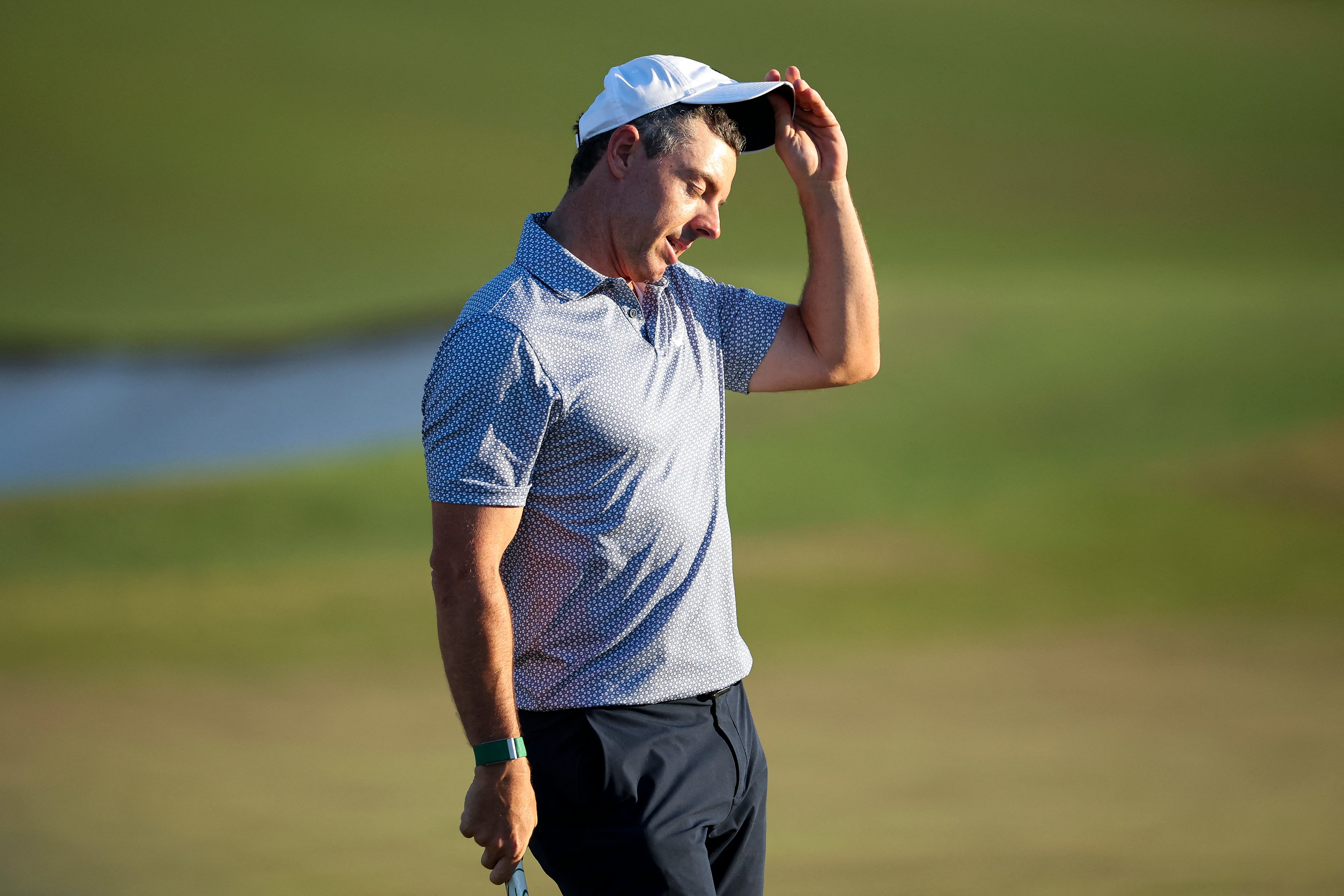 Gasping for air: McIlroy falters, clings on to lead with surging Young