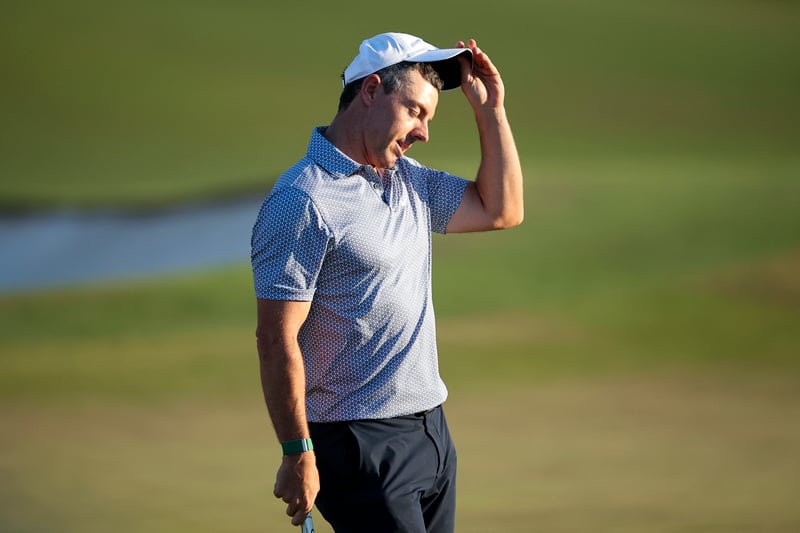 Gasping for air: McIlroy falters, clings on to lead with surging Young