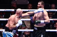 TYSON Fury (left) throws a punch at Arslanbek Makhmudov during their heavyweight 'Clash of the Giants' contest at the Tottenham Hotspur Stadium in London.