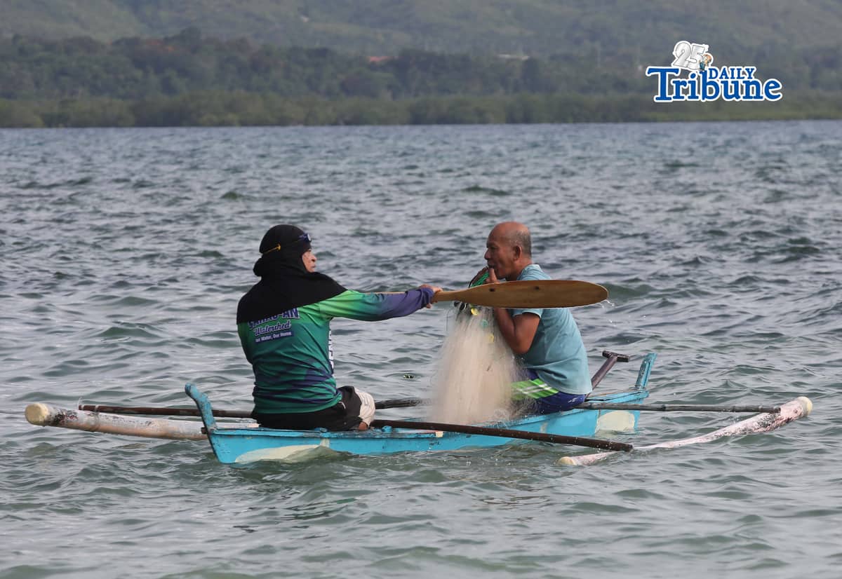(April 11 2026) Fishermen riding a boat carrying fishnet, looking for a fish to catch at Sandingan island, Brgy. Basdio, Loon Bohol on Saturday April 11, 2026. Photo/Analy Labor