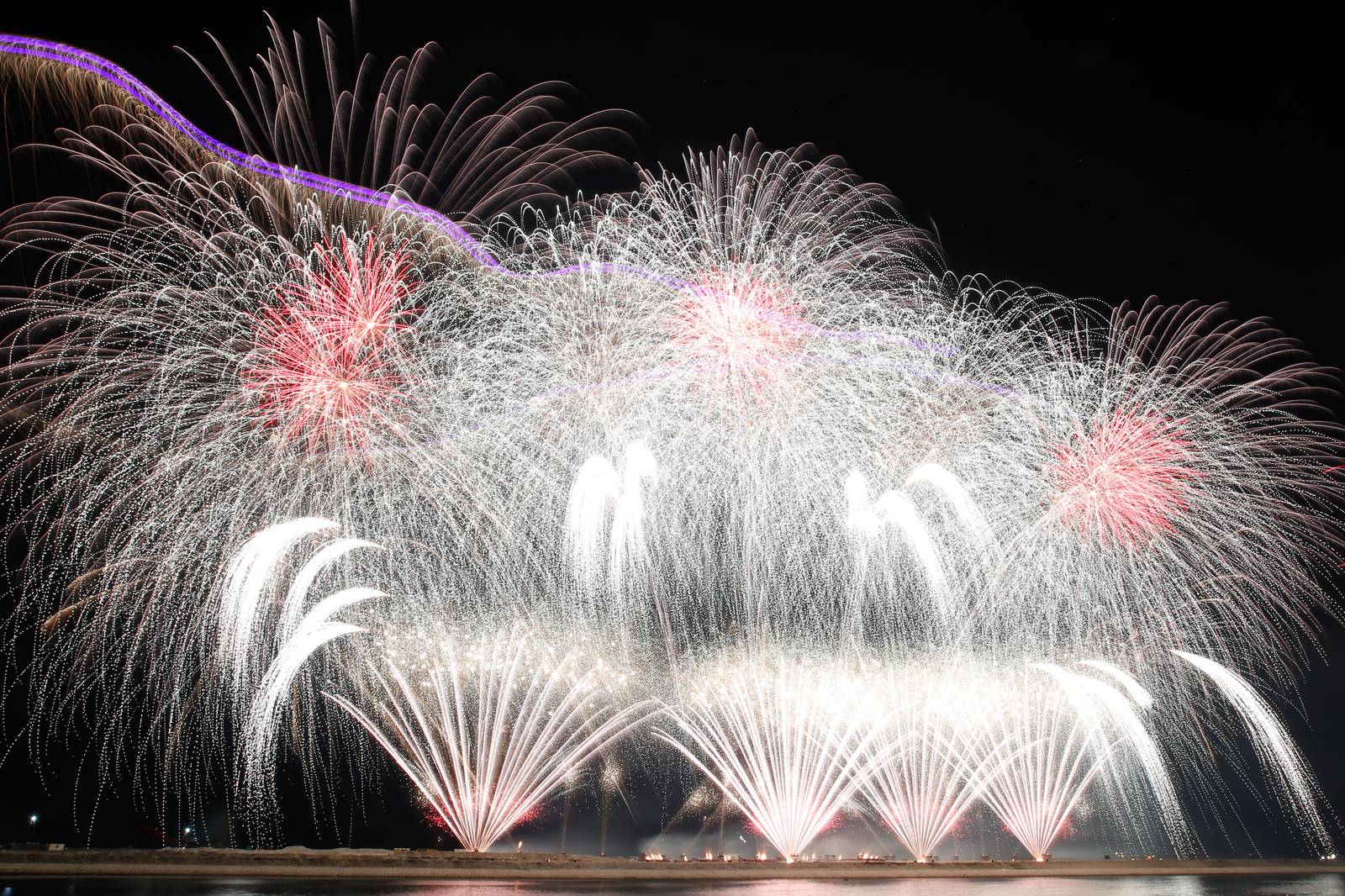 Philippines' Platinum Fireworks Incorporated lights up the Manila Bay skies during the finale exhibition of the 13th Philippine International Pyromusical Competition at the SM Mall of Asia in Pasay City on 11 April 2026. Pyrotex Fireworx from the United Kingdom took this year's championship title, besting seven other competing countries.