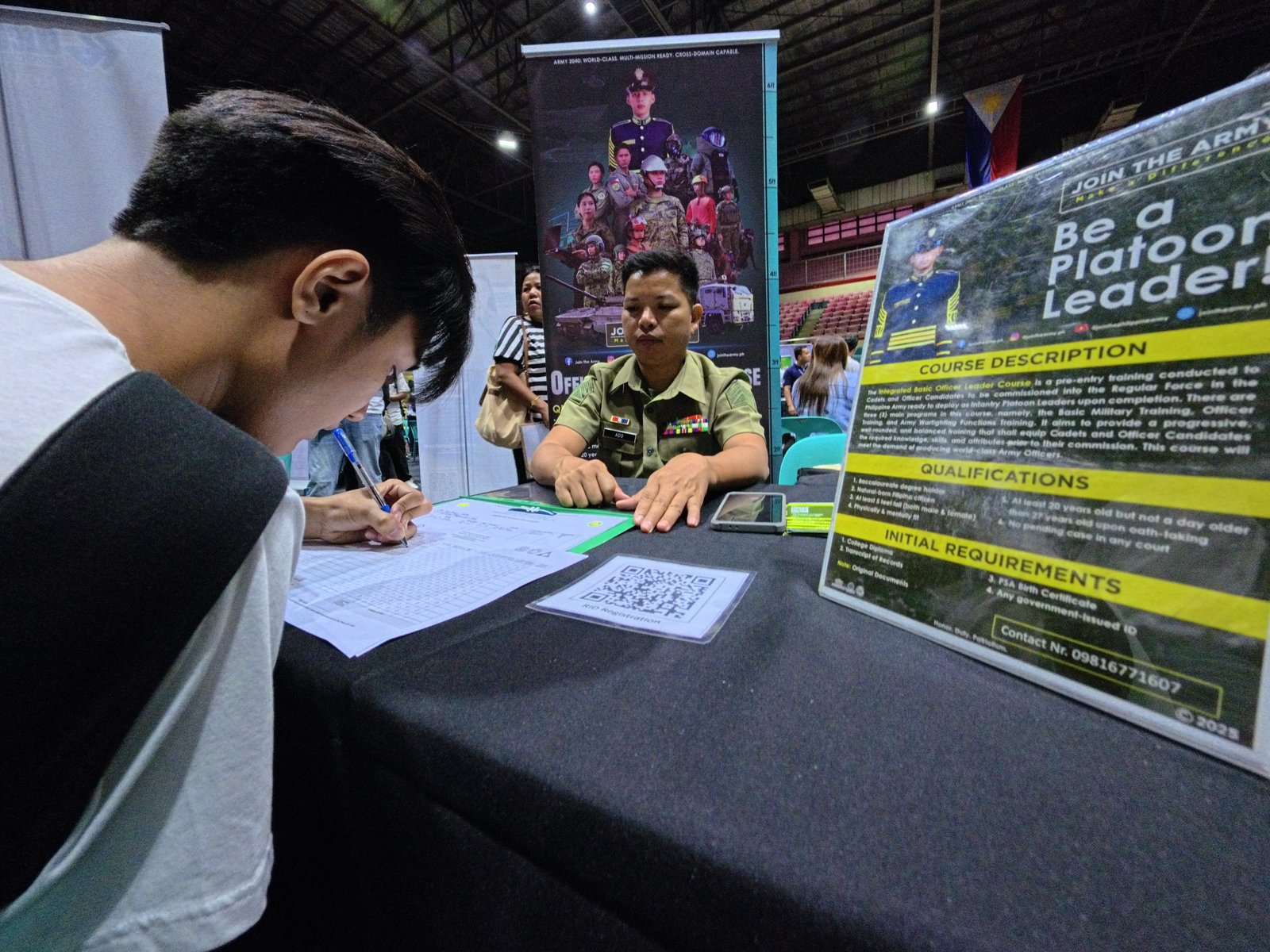 Staff Sergeant Ronnie Ado of the Army Recruitment Office, Philippine Army, facilitates applicants during a job fair at the Pasay City Astrodome today, 13 April 2026. Organized by the city government and its partner agencies, the event features 50 local and overseas employers offering over 6,000 job opportunities.