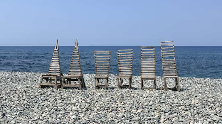 COMPLEMENTING the scenic pebbled beach view, unique wood art displays serve as the perfect backdrop throughout the property.