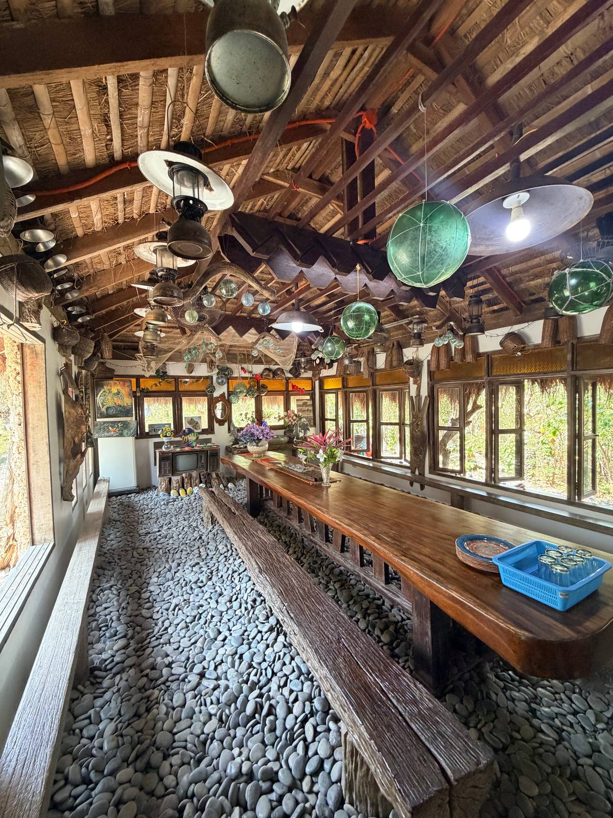 BAHAY na Bato dining area features pebble floors and fishing-inspired décor, reflecting its coastal heritage.