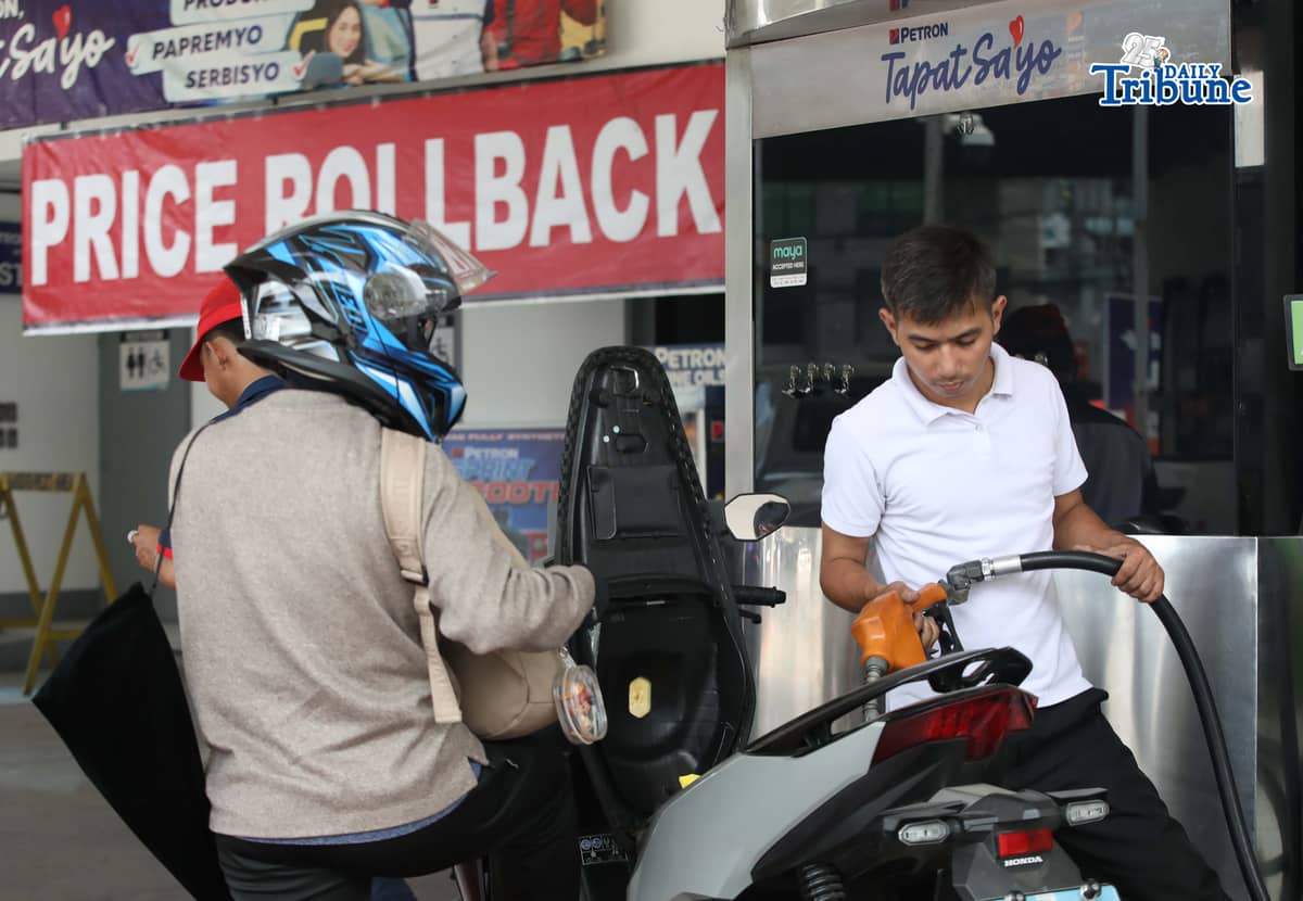 (April 14 2026) A gas station along Katipunan in Quezon City on Tuesday April 14 2026, hanging a tarpaulin with a price rollback sign to inform motorists. Photo/Analy Labor