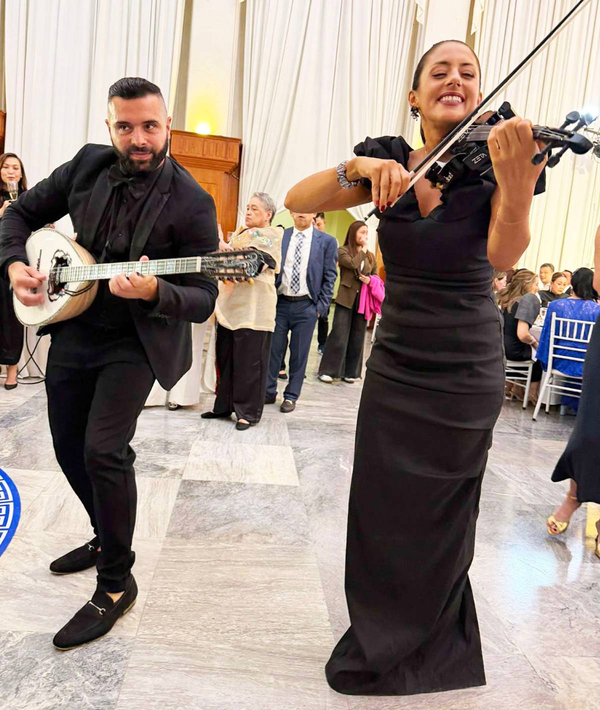 GREEK musicians flown in from Sydney, Tom Tsonis and Melissa Voyias.
