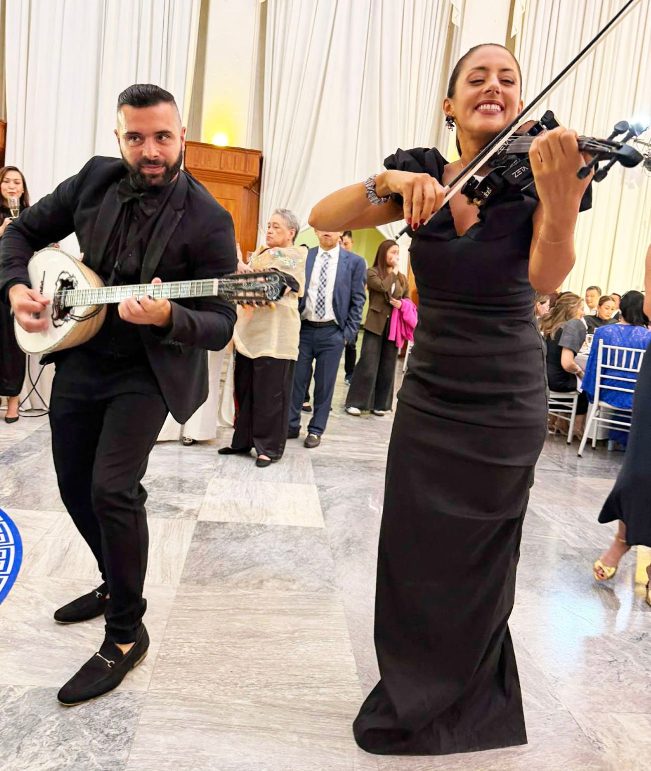 GREEK musicians flown in from Sydney, Tom Tsonis and Melissa Voyias.