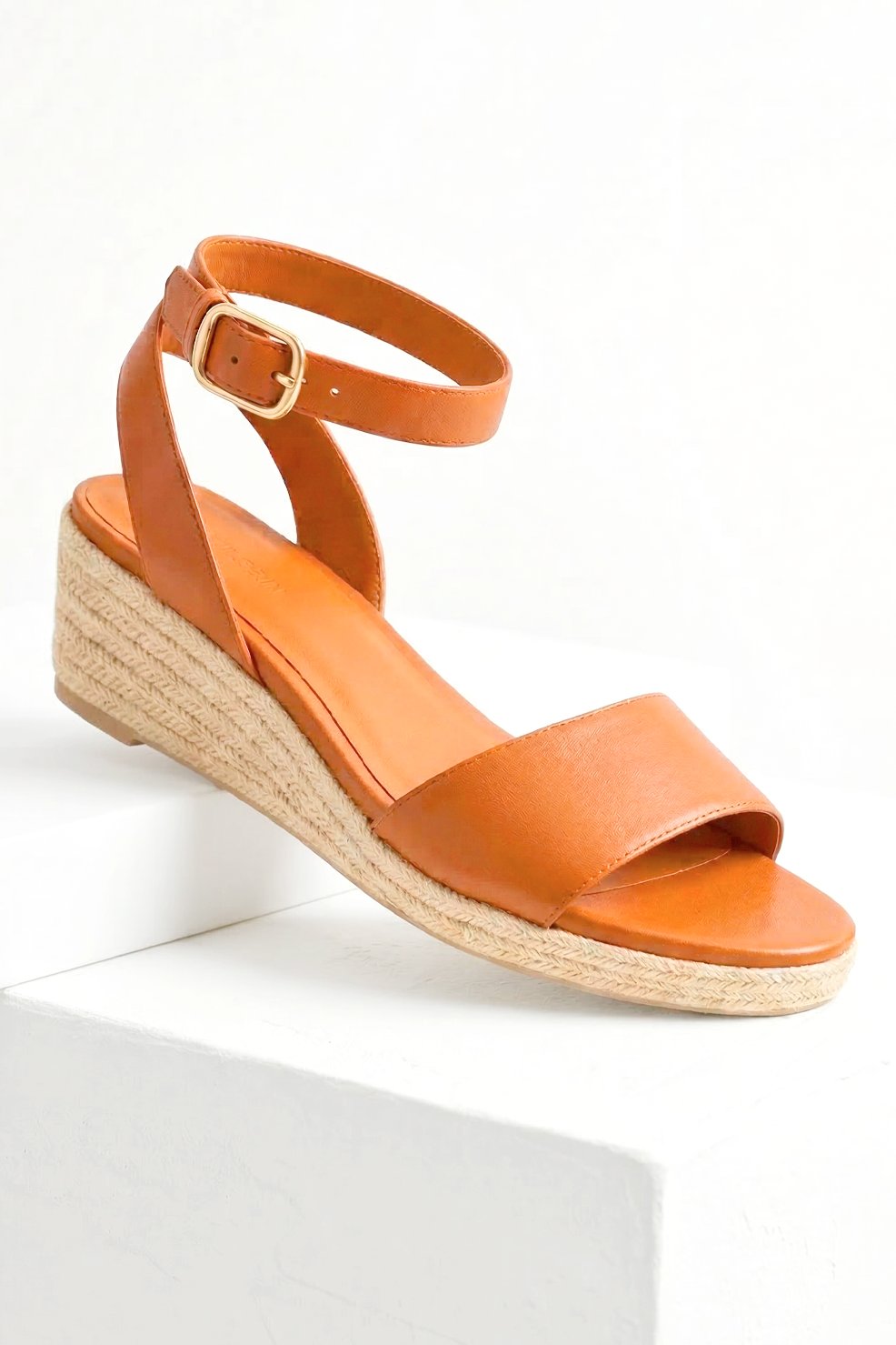 BERNIZ tan wedge in woven espadrille sole and sleek ankle strap.