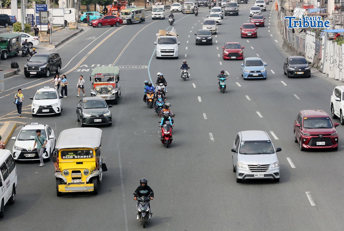 Motorists drive along Commonwealth Avenue in Quezon City on 17 April 2026. The Metropolitan Manila Development Authority observed a slight reduction in traffic on major roads as drivers adjust to rising fuel prices.