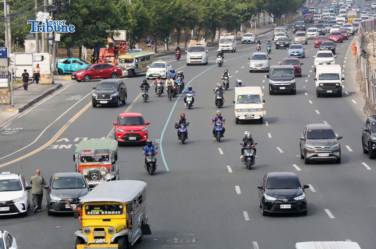 Motorists drive along Commonwealth Avenue in Quezon City on 17 April 2026. The Metropolitan Manila Development Authority observed a slight reduction in traffic on major roads as drivers adjust to rising fuel prices.