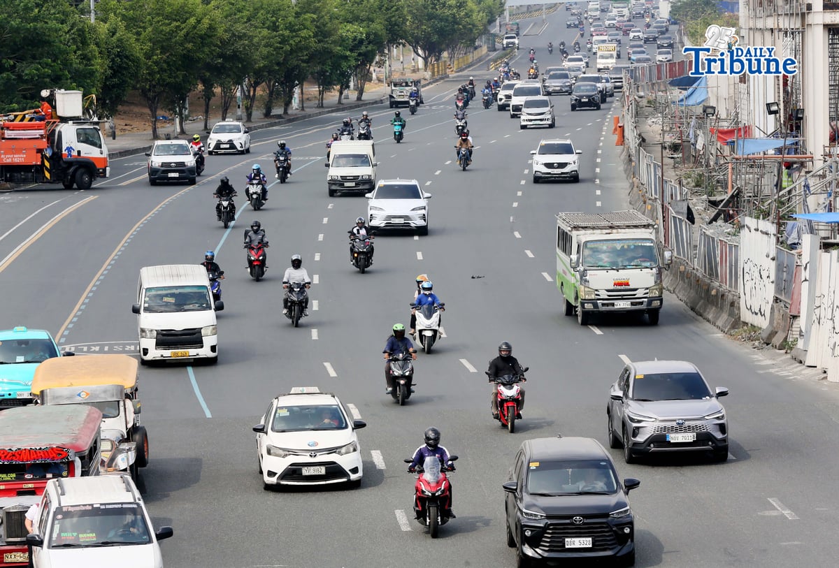 Motorists drive along Commonwealth Avenue in Quezon City on 17 April 2026. The Metropolitan Manila Development Authority observed a slight reduction in traffic on major roads as drivers adjust to rising fuel prices.