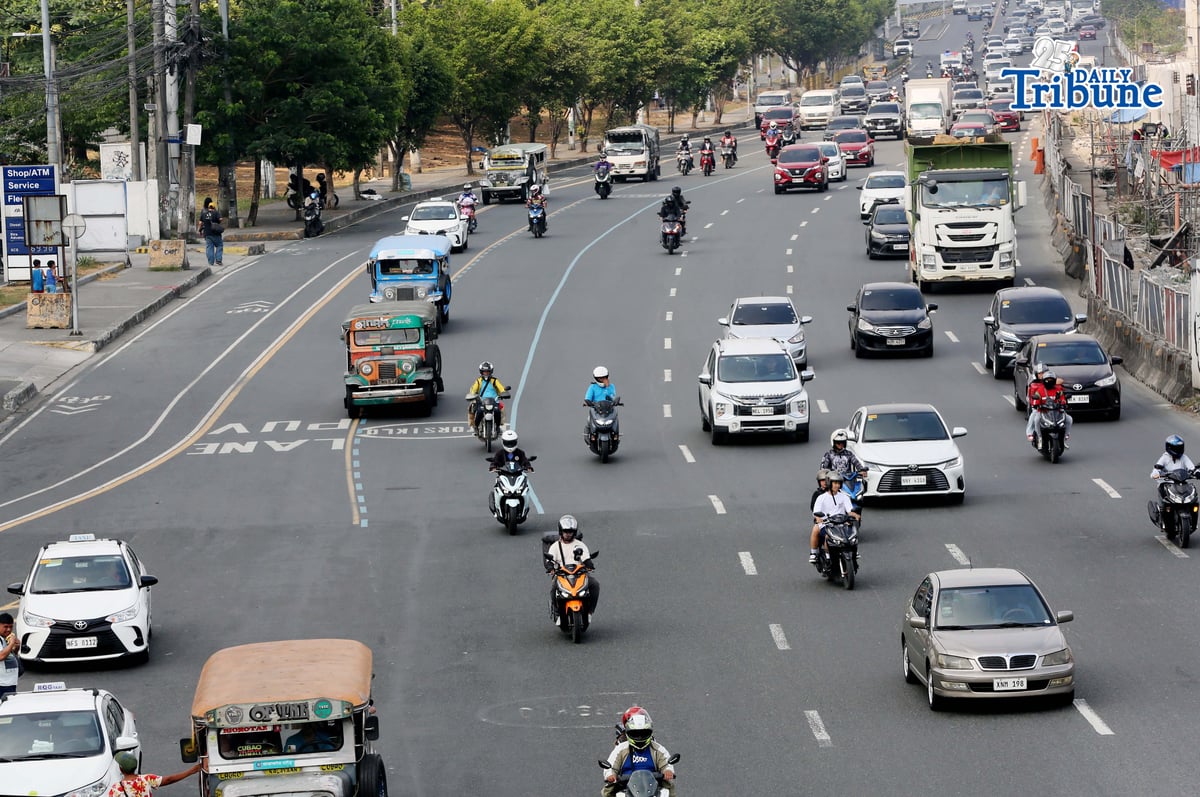 Motorists drive along Commonwealth Avenue in Quezon City on 17 April 2026. The Metropolitan Manila Development Authority observed a slight reduction in traffic on major roads as drivers adjust to rising fuel prices.