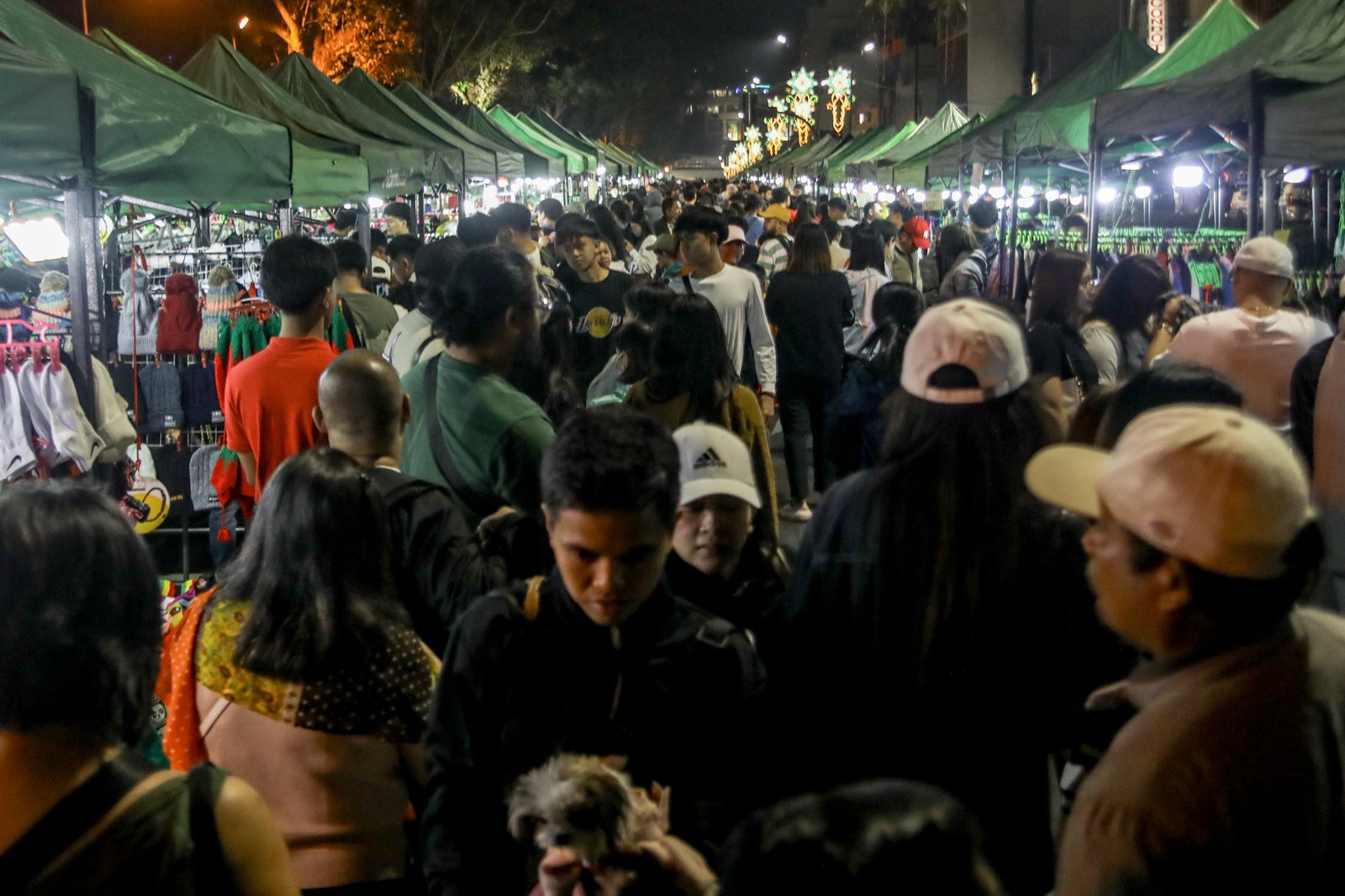 Various tents selling souvenirs, thrifted goods, and food are seen standing along Harrison Road, Baguio City on Friday, 18 April, 2026.| Aram Lascano
