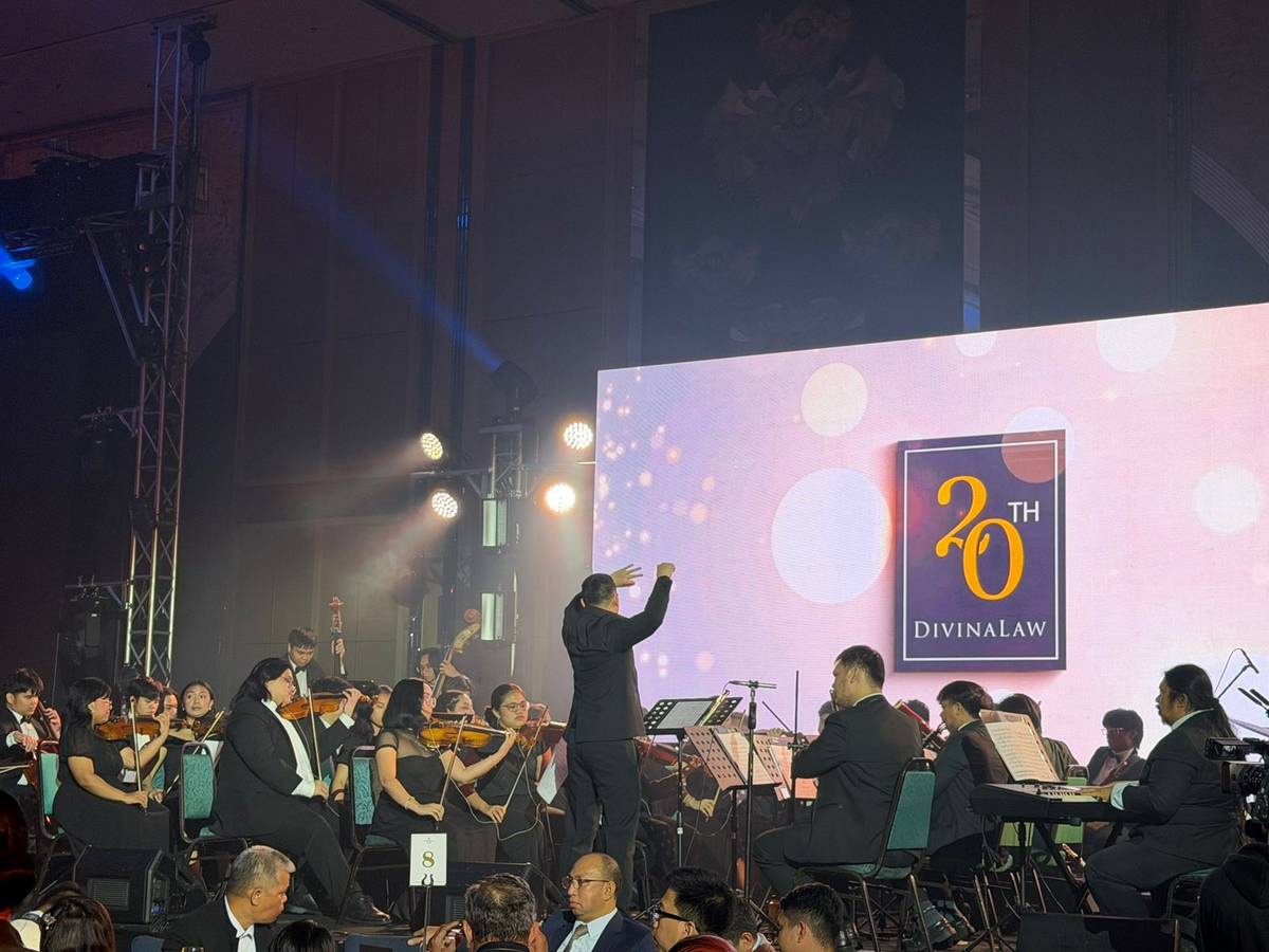 UST Symphony Orchestra performs during the 20th anniversary celebration of DivinaLaw at Shangri-La The Fort in Taguig City, setting an elegant tone for the milestone event.