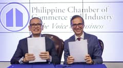 PHILIPPINE Chamber of Commerce and Industry president Perry Ferrer and European Chamber of Commerce of the Philippines president Paulo Duarte show the sealed memorandum of agreement for their collaboration to facilitate trade and investments between European and Philippine firms, in a recent signing ceremony in Taguig City.