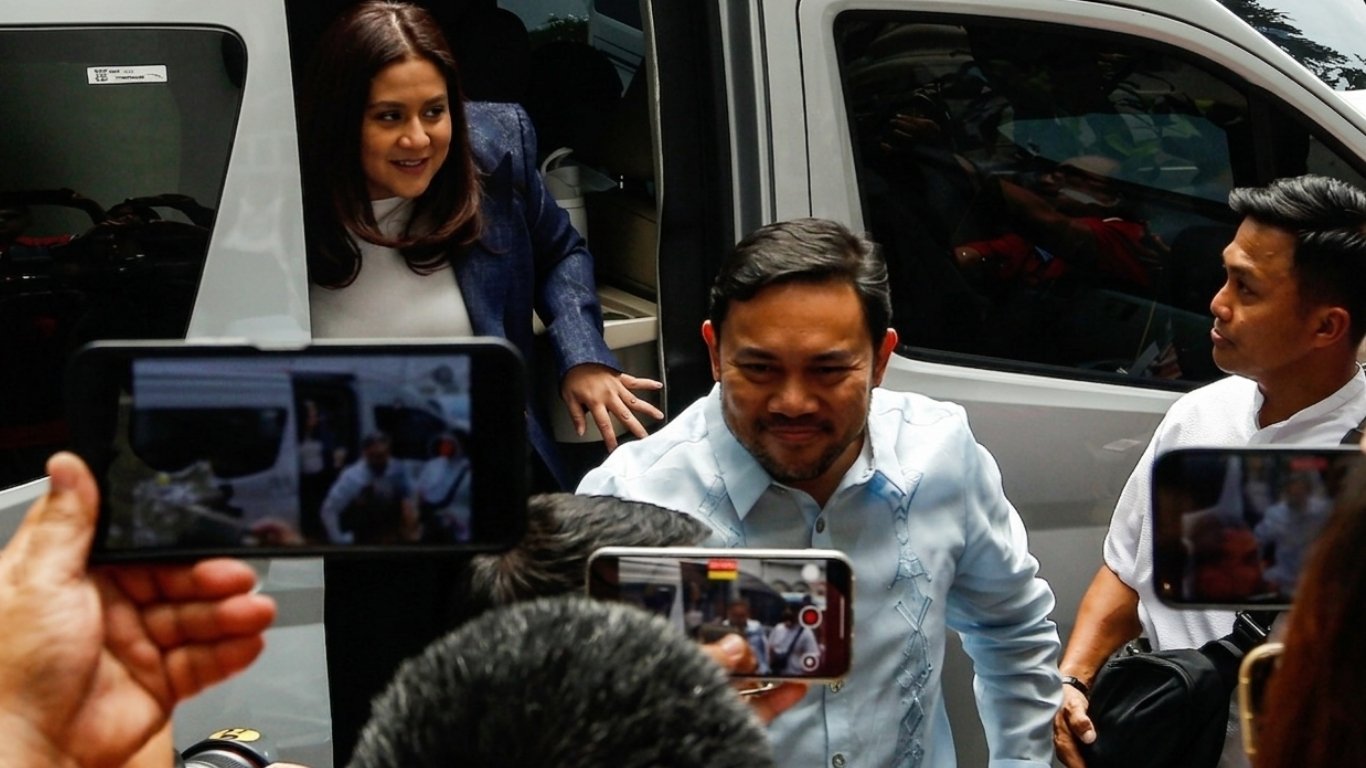 SENATORS Mark and Camille Villar arrive at the Department of Justice on Monday for the continuation of the SEC-linked investigation.