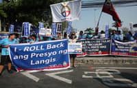 MILITANT groups gather at Philcoa along Commonwealth Avenue in Quezon City on Tuesday to protest rising fuel prices.
