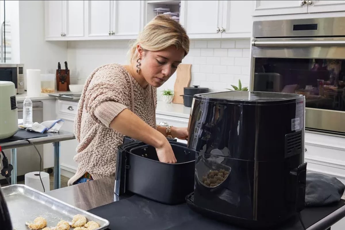 A HOME cook opts for quick, low-heat meal preparation, avoiding additional warmth from prolonged stove cooking.