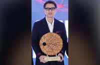 SM Supermalls president Steven Tan receives a plaque of appreciation from Philippine Franchise Association officials during the opening of the Franchise Asia Philippines 2026 International Franchise Conference at the SMX Convention Center in Pasay City.