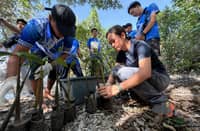 Rooted in collective action. Aboitiz Renewables External Relations Supervisor for Southern Mindanao Christe Torres (right) led fellow team members in preparing mangrove seedlings during a coastal rehabilitation activity with volunteers and community partners at the Bacutan Pawikan Sanctuary and Mangrove Reserve in Barangay Astorga, Sta. Cruz, Davao del Sur.