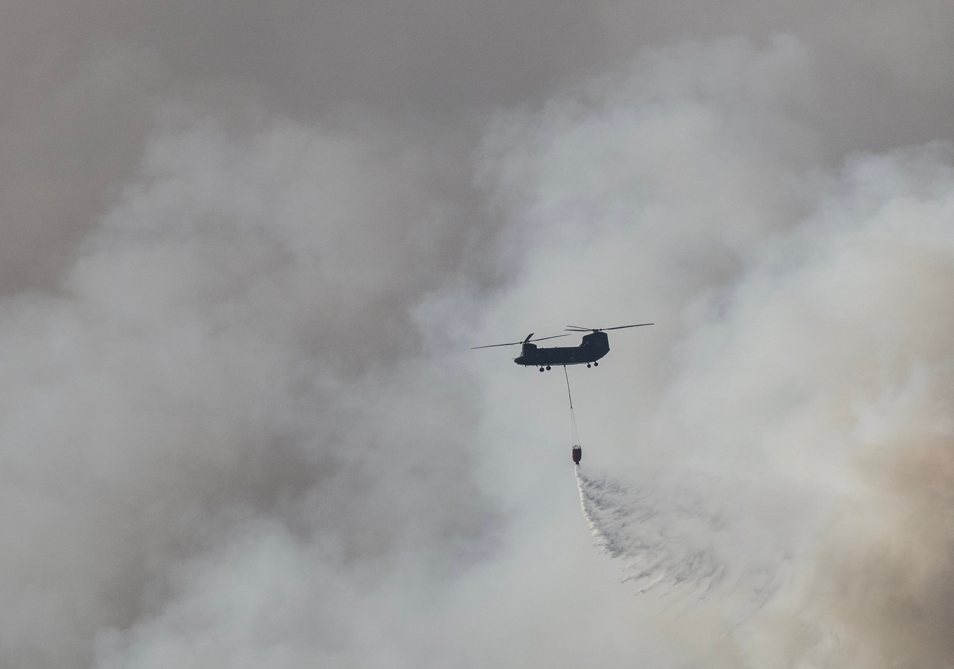Hundreds of firefighters battle Japan forest blazes
