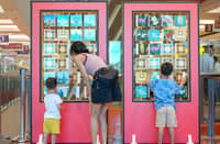 CHILDREN explore the interactive features.