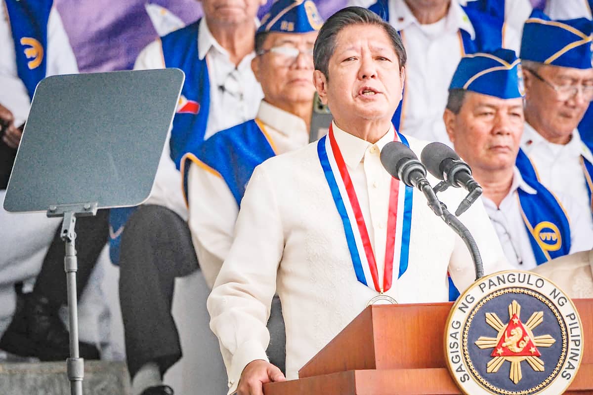 BARE-EYED beneath the April sun, the President leads the Araw ng Kagitingan rites.
