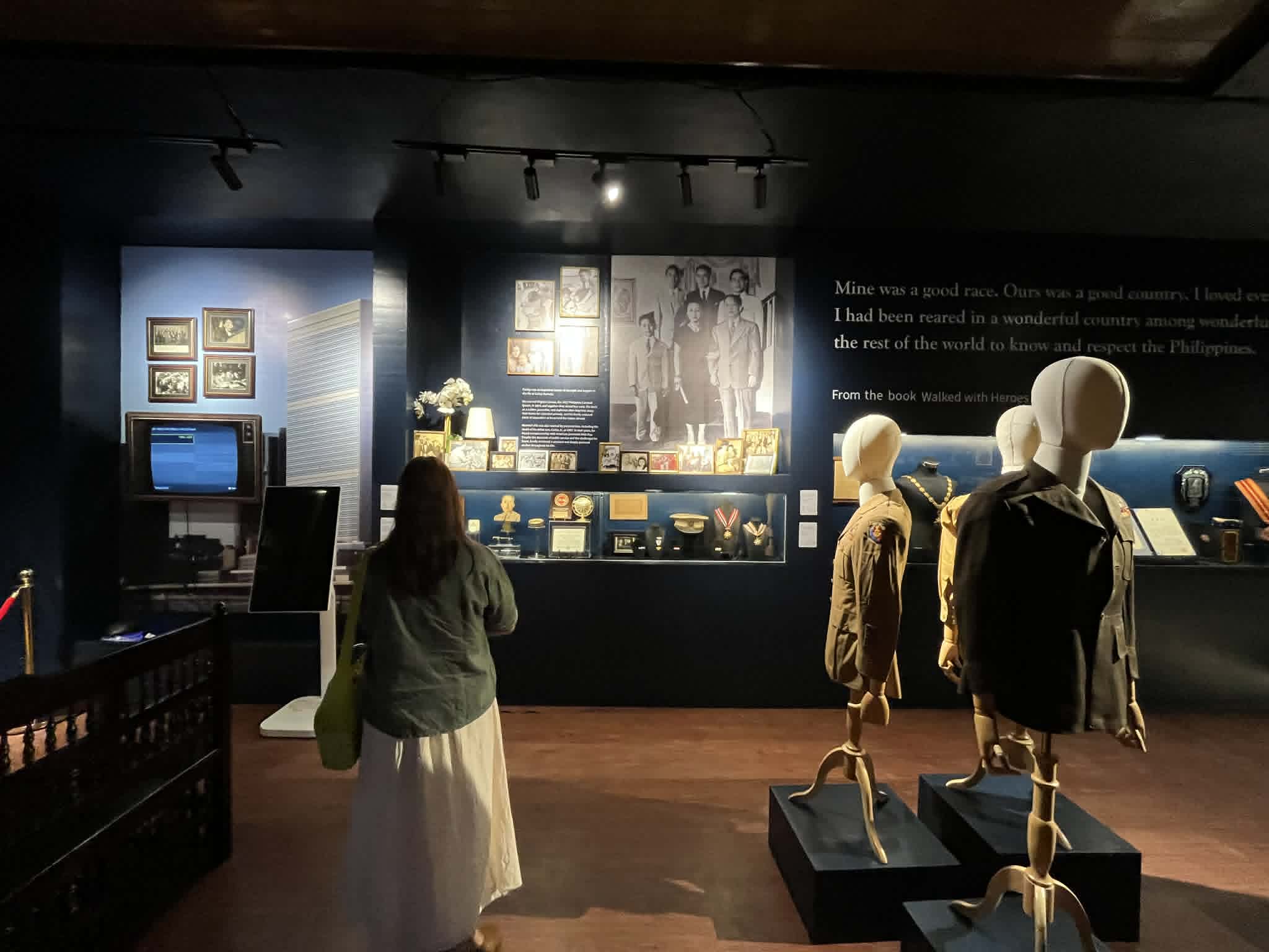 A MUSEUM guest takes in a section of the exhibit, where archival images and memorabilia narrate Romulo’s life and legacy.