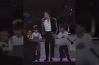 IC Mendoza (kid in white) with Michael Jackson on stage.