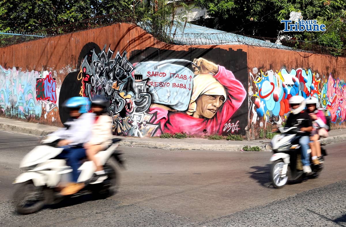 (May 01 2026) A mural portraying workers’ struggles and urging higher wages and lower prices of basic commodities seen along Himlayan road in Quezon City on Friday, May 1, 2026. An Artist tribute to the workers during Labor Day Celebrations. Photo/Analy Labor