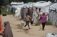 PEOPLE fetch drinking water at the Bureij camp for Palestinian refugees in the central Gaza Strip on 28 April 2026.