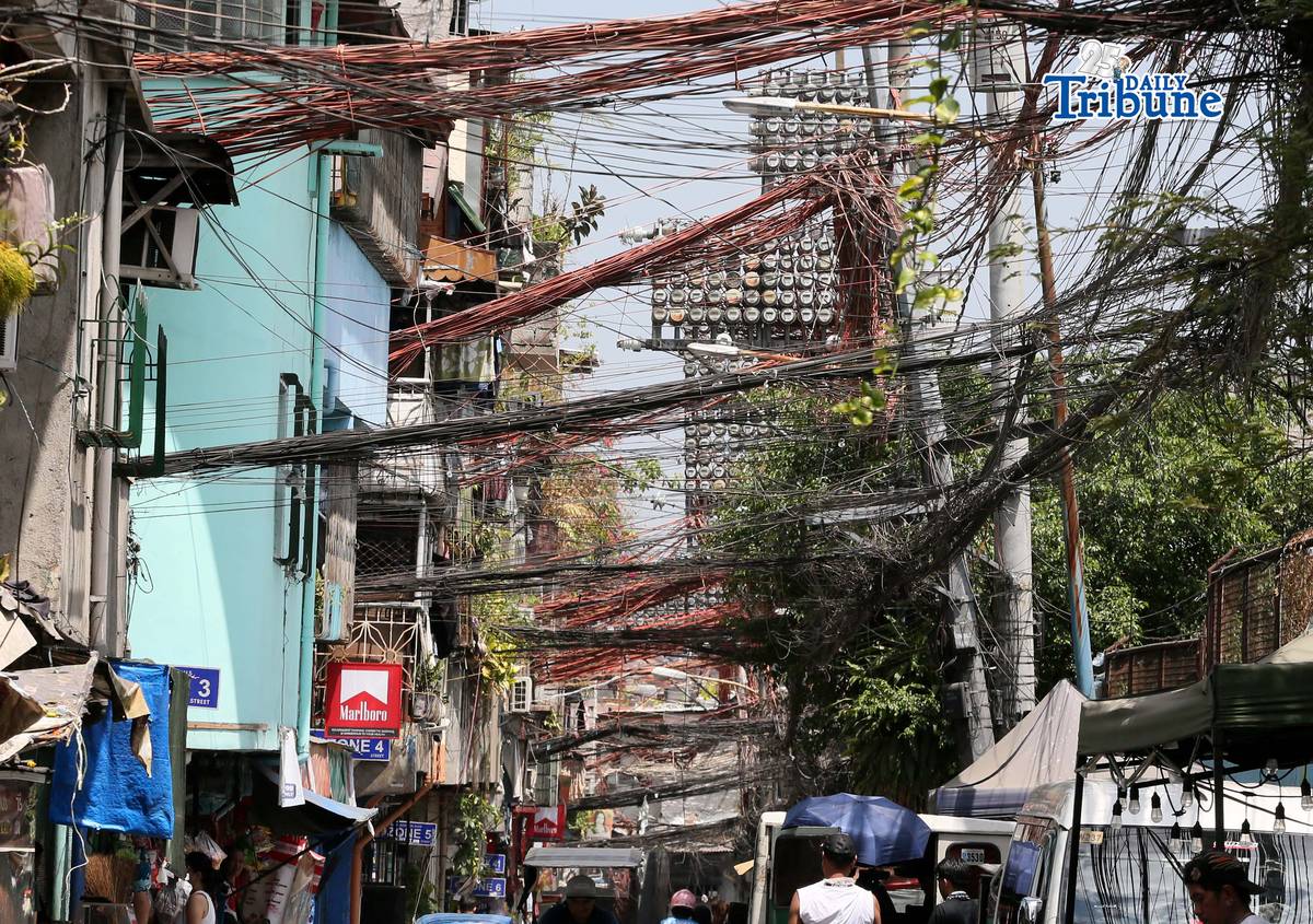 (May 02 2026) Tangled electric wires or “Spaghetti wires” seen at crowded street in Mandaluyong City, on Saturday May 2 2026, as electricity costs surge alongside the sweltering heat, on May 2, 2026. Photo/Analy Labor