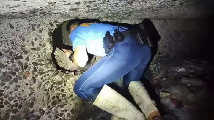Operatives from QCPD Novaliches Police Station 4 discovered a tunnel allegedly dug by unidentified suspects to gain entry into a pawnshop in Brgy. Nova Proper, Quezon City. (Screenshot photo from QCPD)