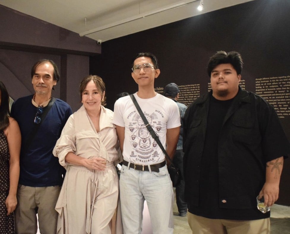 Artinformal’s Tina Fernandez (second from left) with the artists at the exhibition.
