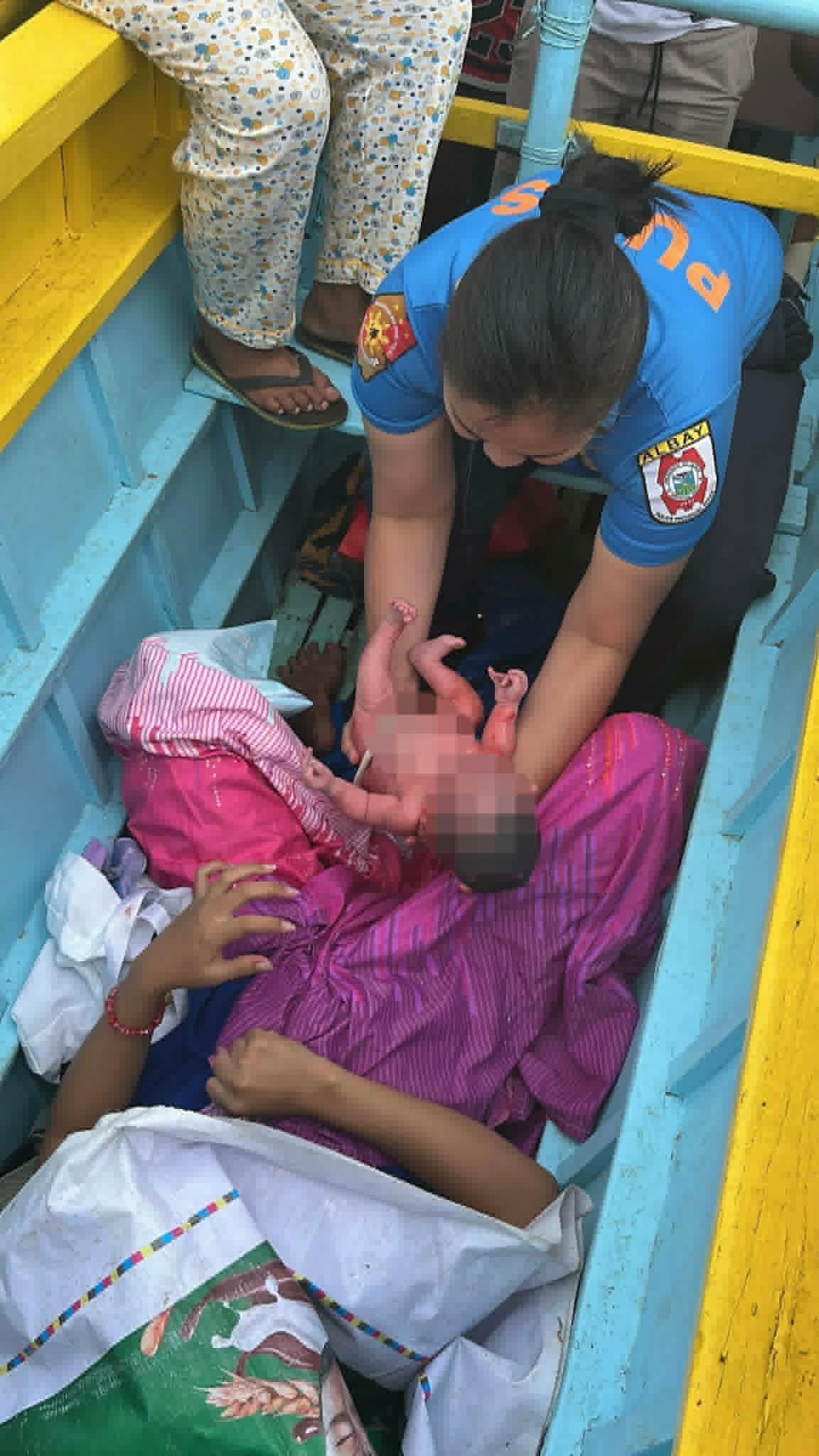 Lady cop delivers baby aboard motorbanca in Albay