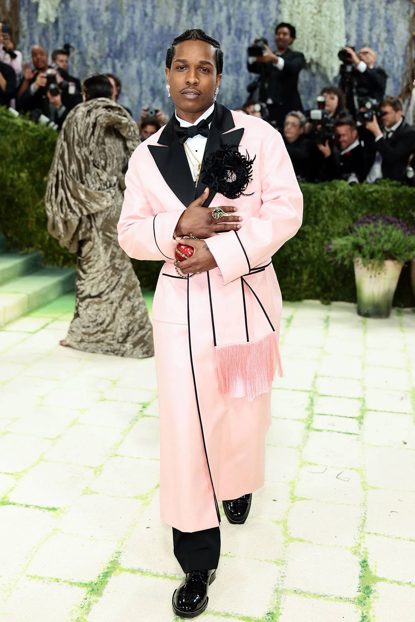 A$AP Rocky proves that sophistication can feel very modern, as seen in this gorgeous pink Chanel silk coat