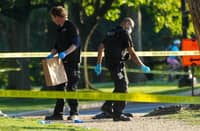 CRIME scene technicians catalog evidence following an exchange of gunfire between a US Secret Service agent and a gunman on the National Mall in Washington, D.C.