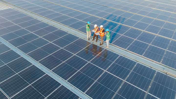 ENGINEERS and workers inspect rooftop solar panels installed at an SM Supermalls facility as part of the company’s energy efficiency and sustainability initiatives.