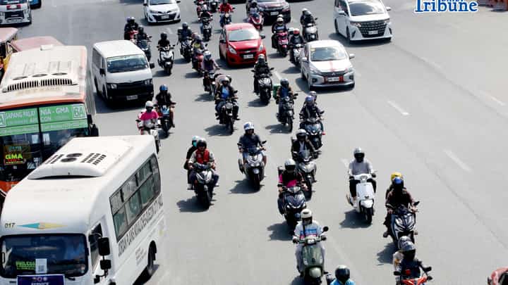 Motorcycle taxi riders passing the Commonwealth Avenue in Quezon City on Friday, 8 May 2026.