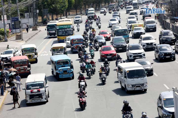 (May 08 2026) Motorcycle plying along Commonwealth Avenue in Quezon City on Friday May 8 2026. The Department of Social Welfare and Development has ordered transport network companies to submit all the names of drivers onboarded in their system. This is related to discrepancies in the list of TNVS drivers and motorcycle taxi riders who are beneficiaries of the fuel subsidy. DSWD Spokesperson Asec. Irene Dumlao assured that the list of drivers who will receive cash relief assistance from the department is clean. But the list of drivers who will be given assistance under the AICS will still come from the LTFRB. Photo/Analy Labor