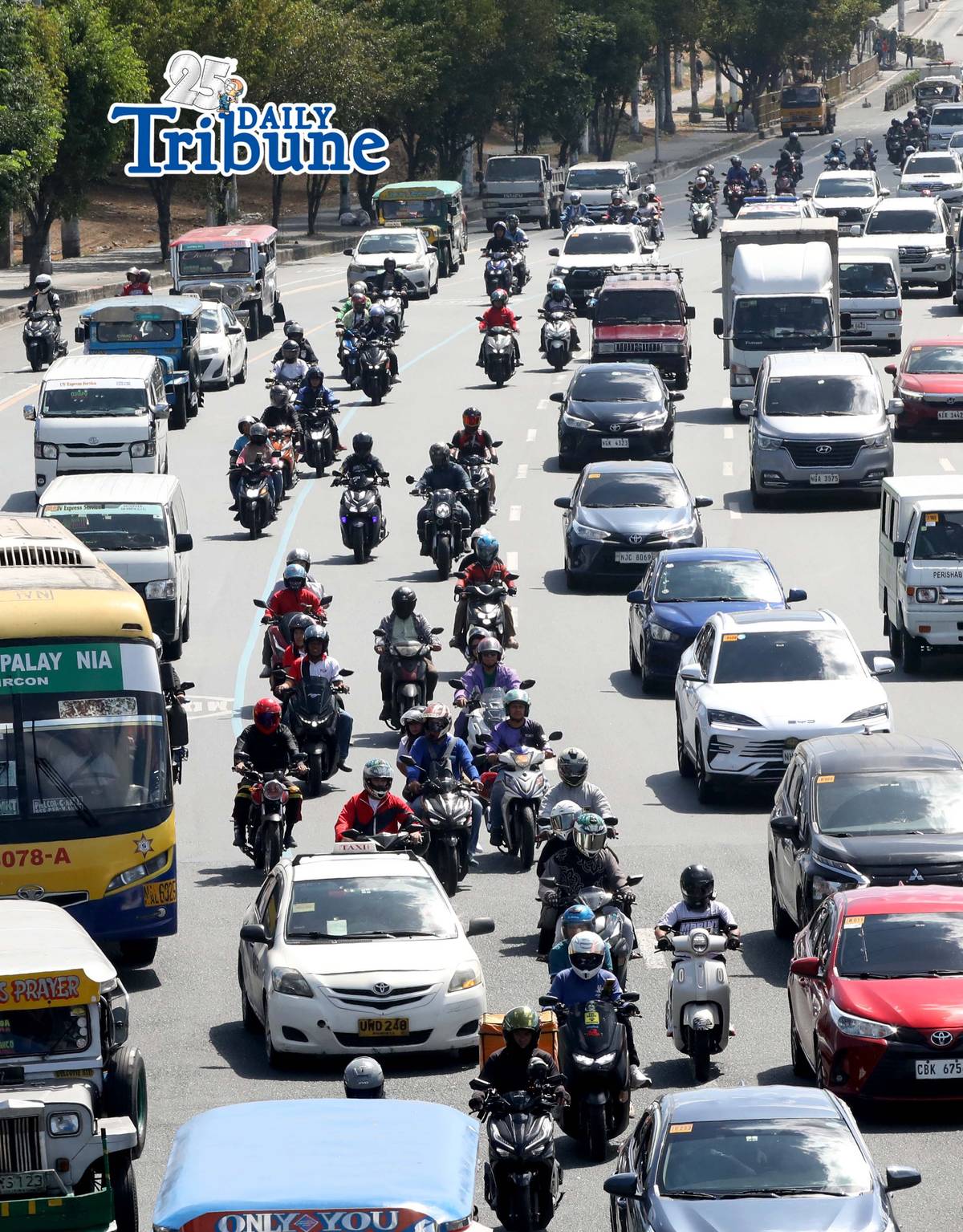 (May 08 2026) Motorcycle plying along Commonwealth Avenue in Quezon City on Friday May 8 2026. The Department of Social Welfare and Development has ordered transport network companies to submit all the names of drivers onboarded in their system. This is related to discrepancies in the list of TNVS drivers and motorcycle taxi riders who are beneficiaries of the fuel subsidy. DSWD Spokesperson Asec. Irene Dumlao assured that the list of drivers who will receive cash relief assistance from the department is clean. But the list of drivers who will be given assistance under the AICS will still come from the LTFRB. Photo/Analy Labor