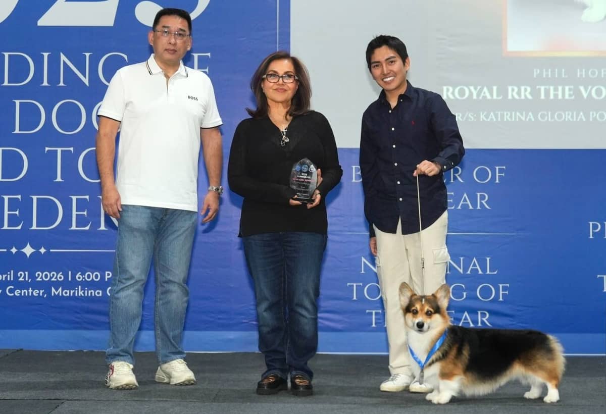 PROUD mom: KPE (center) with Welsh Corgi Luke.