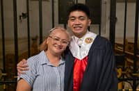 Rhoda Orcullo (left) sharing a moment with her son Jerod Orcullo (right), a reporter for the Daily Tribune, during the latter's college graduation from Colegio de San Juan Letran.