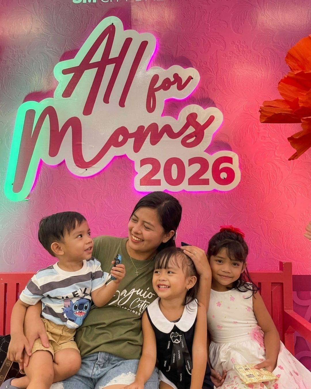 A MOTHER spends time with her children at a Mother’s Day-themed installation at SM City Daet.